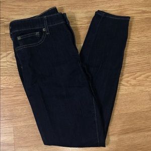 Women’s size 8 dark blue skinny jeans.